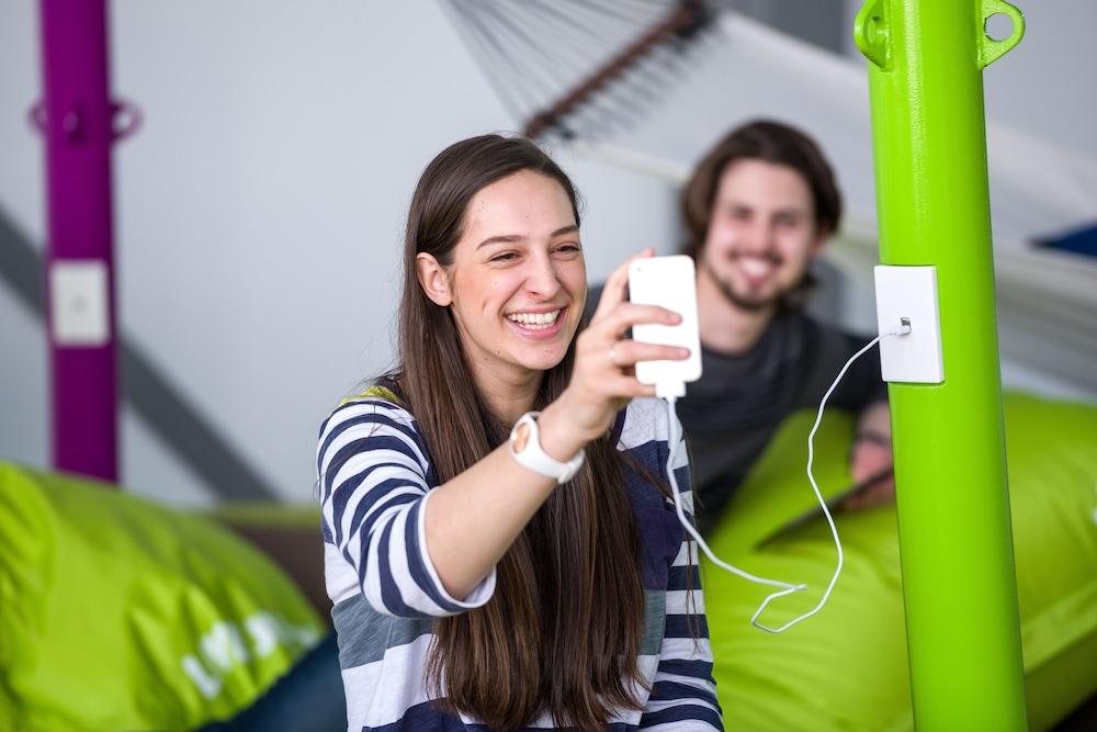 Lylo Κράισττσερτς Εξωτερικό φωτογραφία A student using a mobile phone at the University of Applied Sciences and Medical University of Southern Tyrol